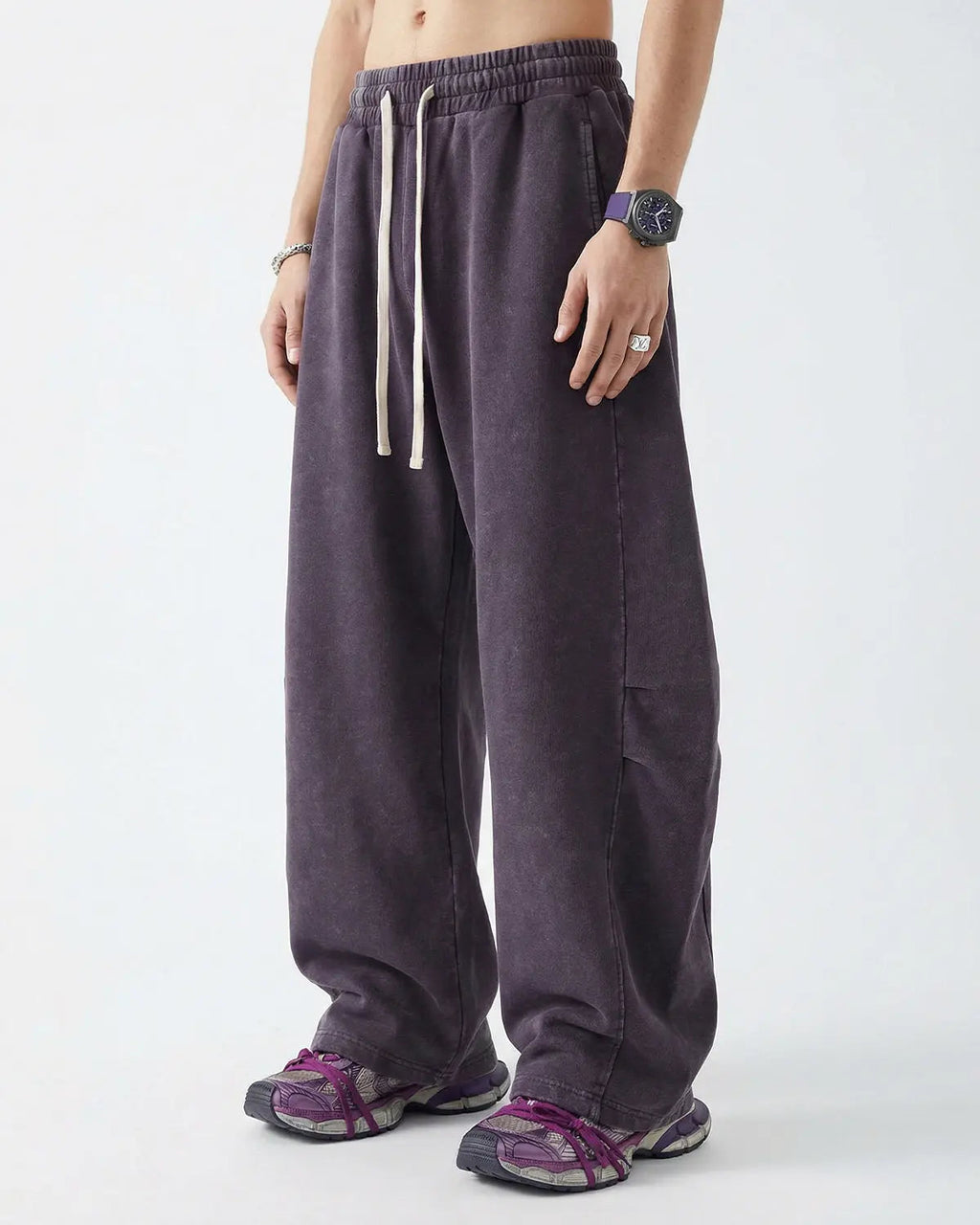 Distressed acid washed barrel sweatpants from INFLATION Streetwear featuring a relaxed fit and faded, vintage-style fabric.