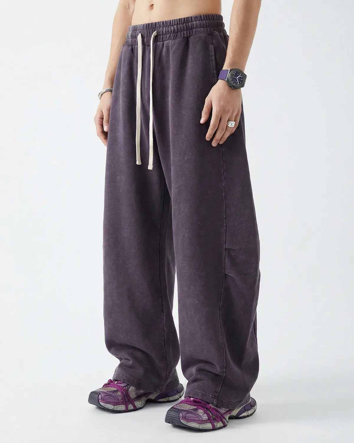 Distressed acid washed barrel sweatpants from INFLATION Streetwear featuring a relaxed fit and faded, vintage-style fabric.