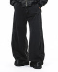 Acid washed black barrel jeans from INFLATION Streetwear, featuring a relaxed fit and distressed denim style.