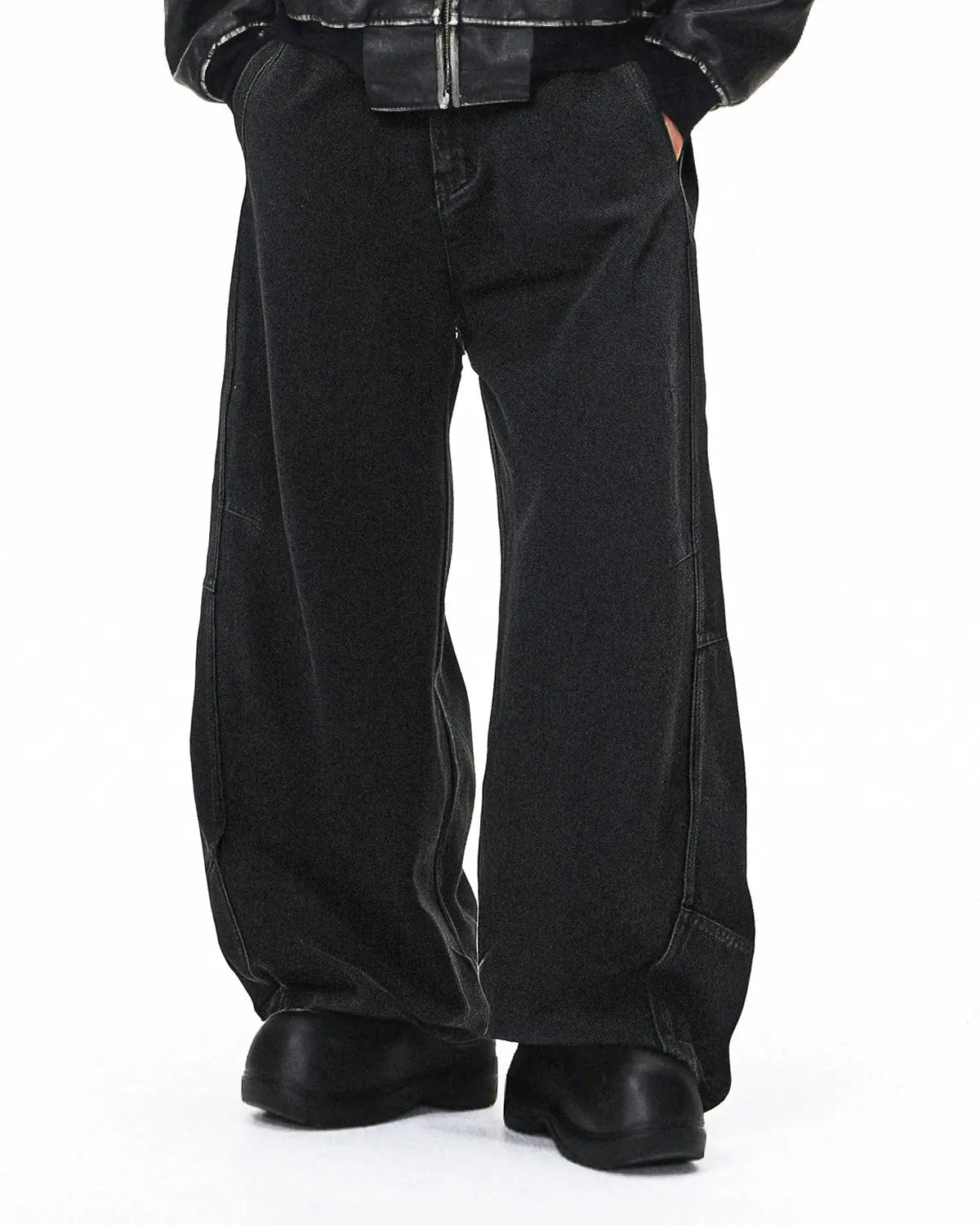 Acid washed black barrel jeans from INFLATION Streetwear, featuring a relaxed fit and distressed denim style.