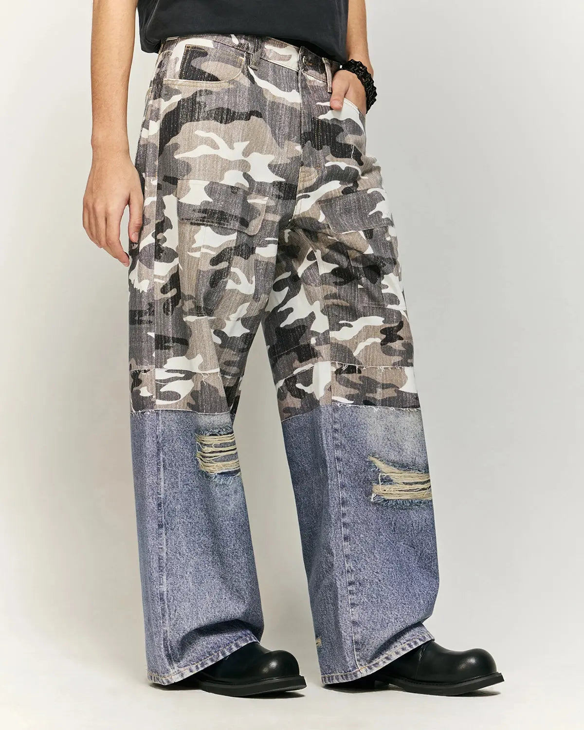 Inflation streetwear patchwork print baggy jeans with colorful patchwork design, relaxed fit, and denim fabric.