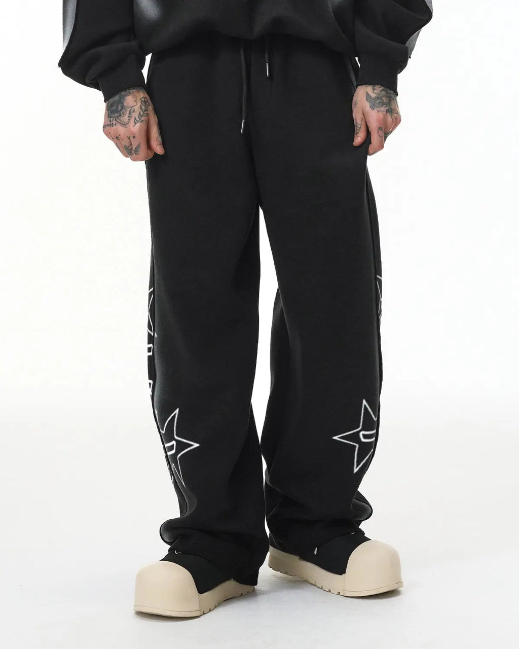 Inflation Stitching Spray-Painted Graffiti Sweatpants featuring colorful spray paint graffiti design and relaxed streetwear fit.