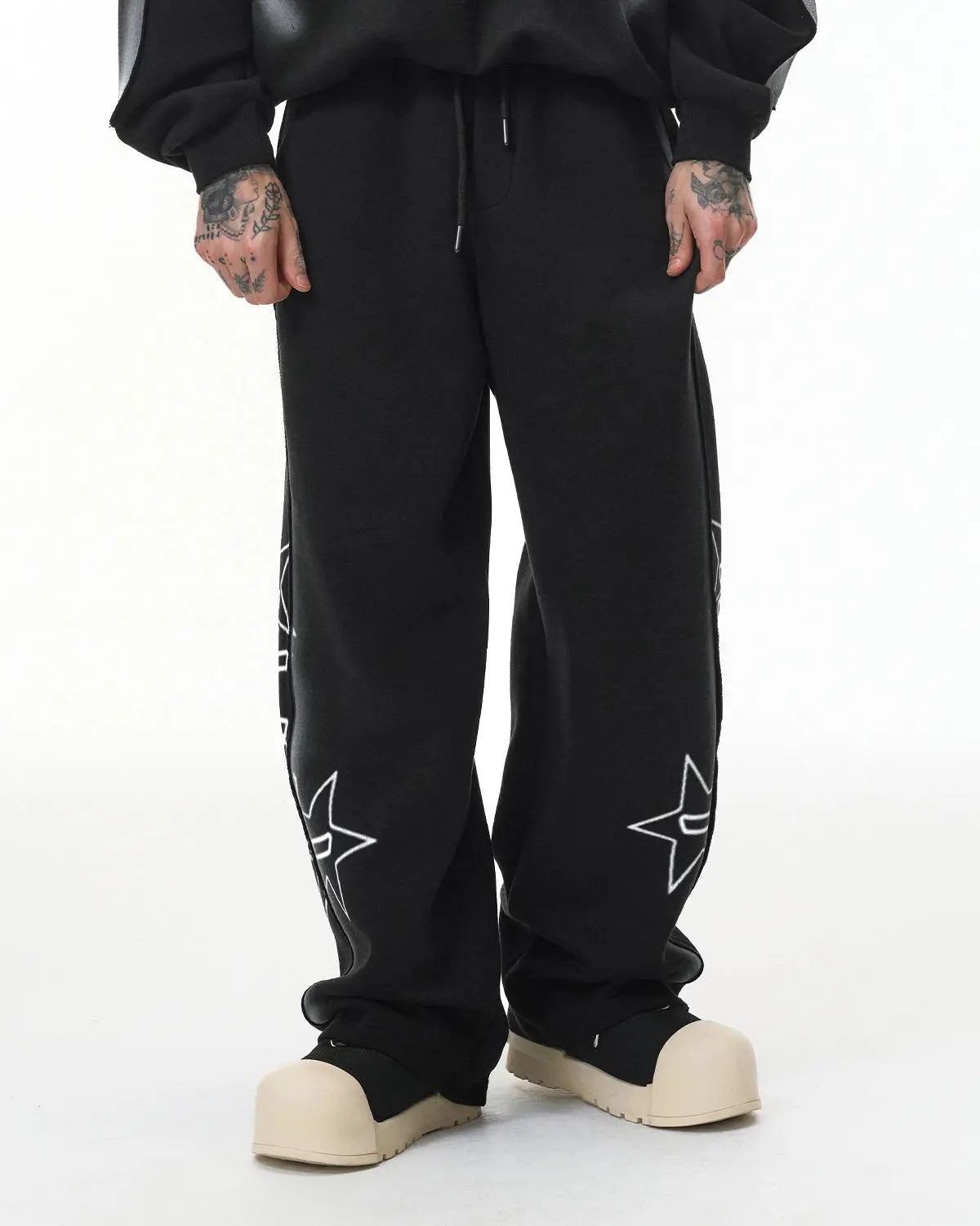 Inflation Stitching Spray-Painted Graffiti Sweatpants featuring colorful spray paint graffiti design and relaxed streetwear fit.