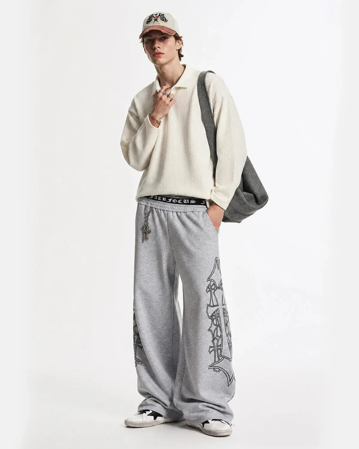 Gothic layered baggy sweatpants by INFLATION, featuring a streetwear style with a relaxed fit and layered design.