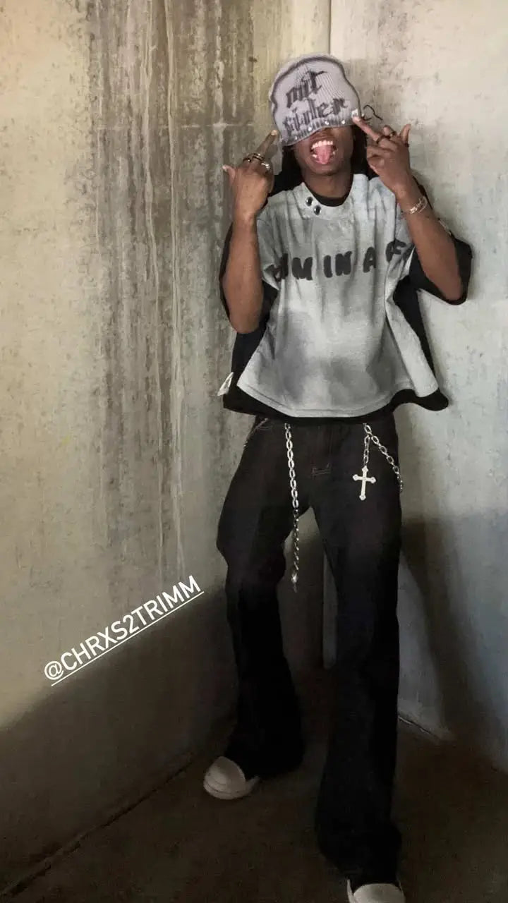 Inflation Super Raw Flared Baggy Jeans with distressed details, high waist, and wide leg fit, styled with casual streetwear.