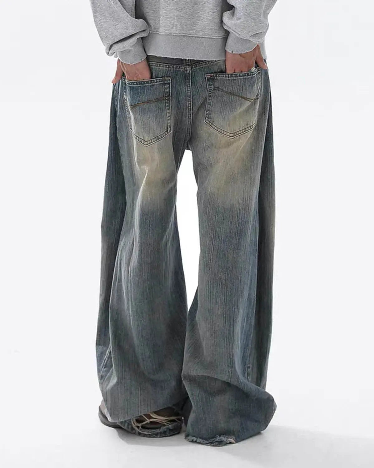 Washed bamboo weave baggy bootcut jeans by INFLATION with relaxed fit and casual streetwear style, shown in a front view.