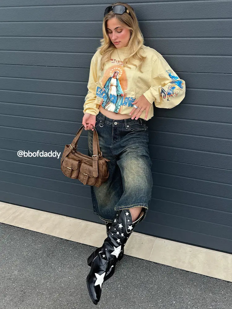 Baggy jumbo jorts by INFLATION featuring oversized denim shorts with a relaxed fit and distressed details.