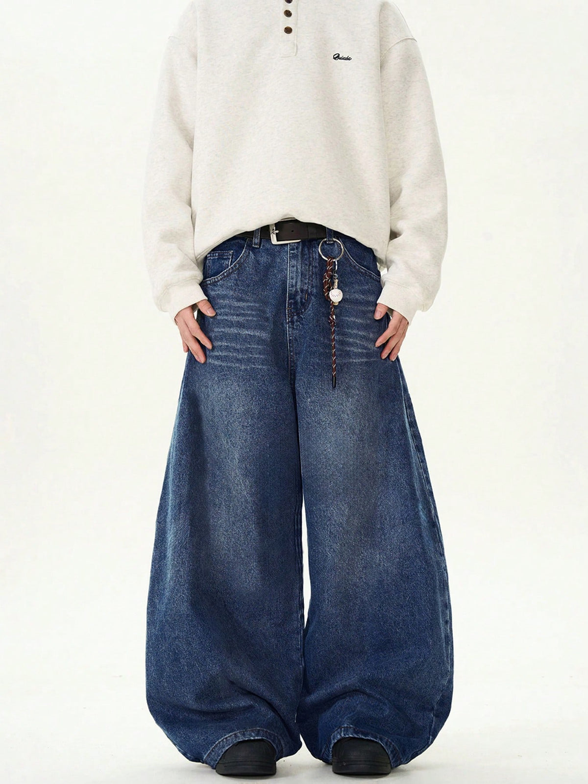 Inflation vintage distressed denim jeans with wide leg, loose fit, and distressed details, perfect for casual streetwear style.