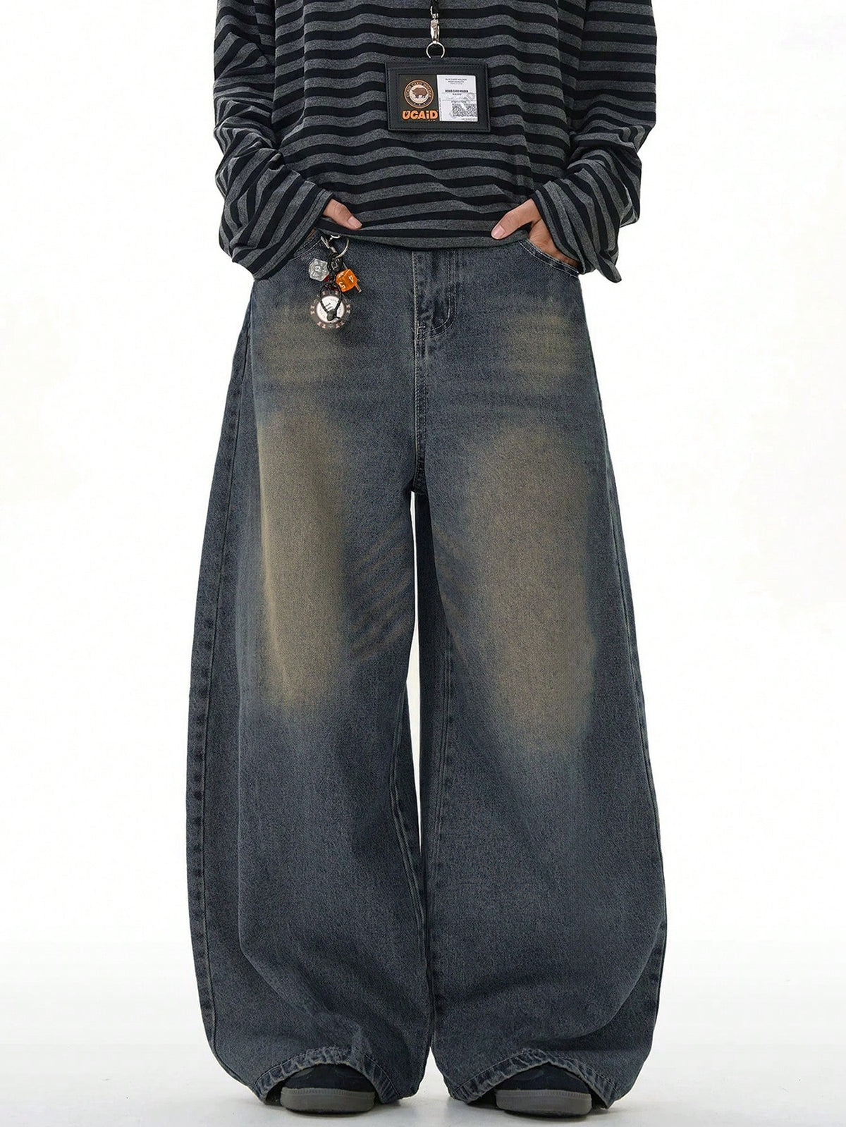 Inflation vintage distressed denim jeans with wide leg and loose fit, showcasing faded fabric and distressed details.
