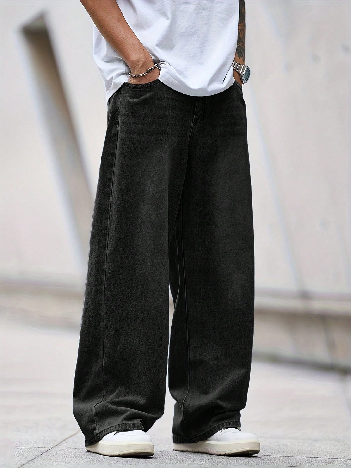 Black inflation street style loose denim jeans with a relaxed fit, featuring a casual streetwear design.