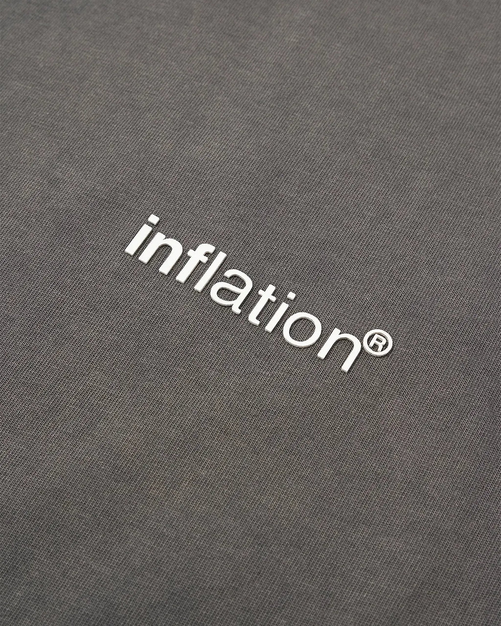 Inflation Streetwear distressed washed tee shirt in a casual fit, featuring a vintage-inspired design and faded fabric.