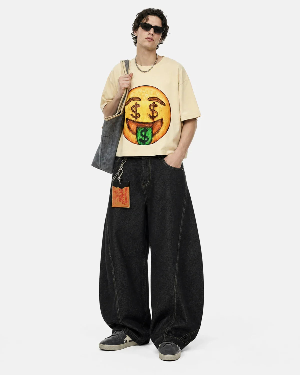 Boxy Smile Graphic T-Shirt by INFLATION featuring a bold smiley face design on soft cotton fabric.