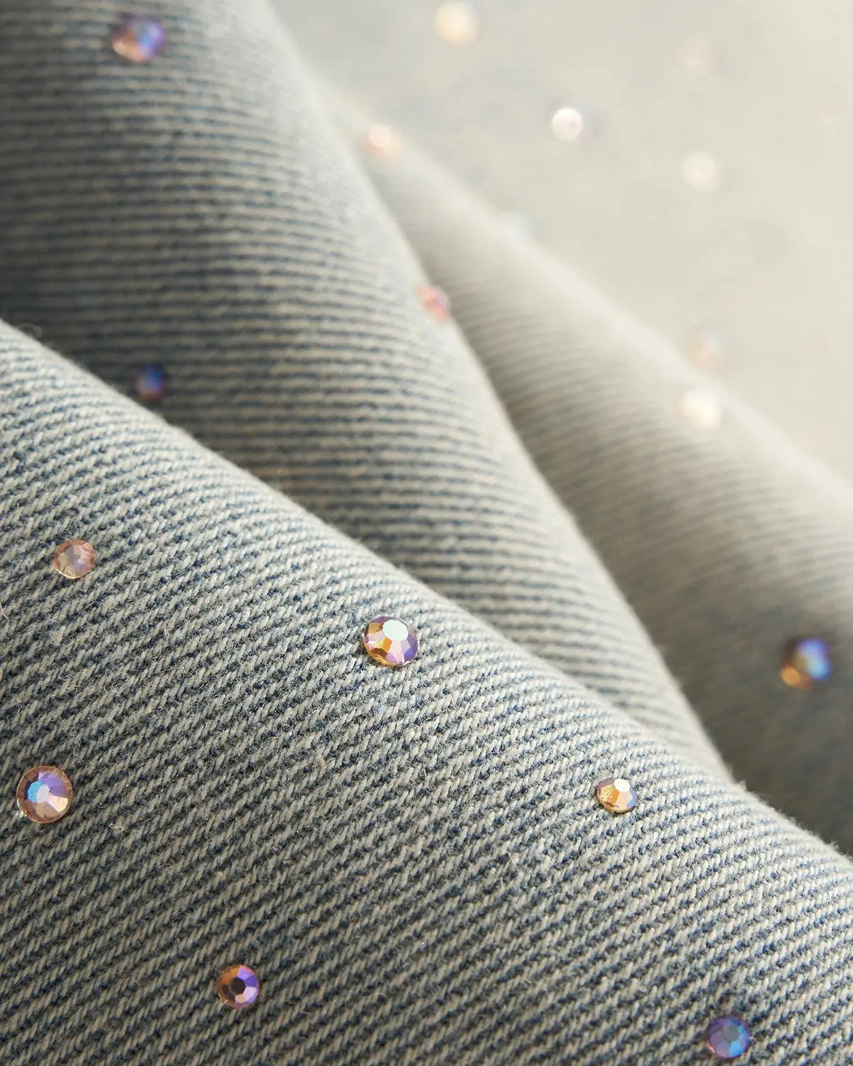 Washed rhinestone baggy jeans from INFLATION, streetwear pants with rhinestone details and a relaxed, oversized fit.