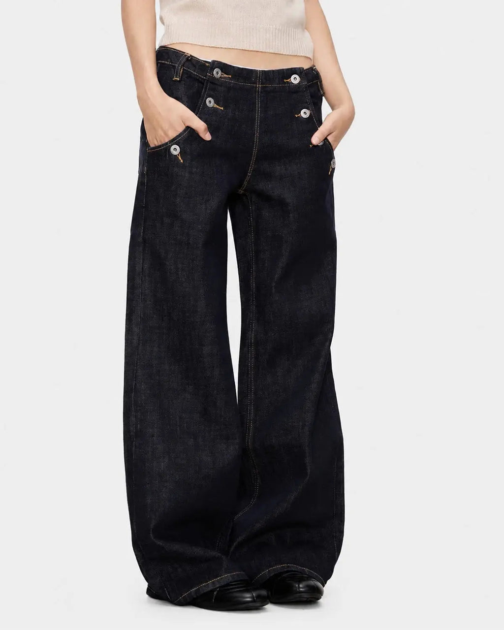Raw wide-leg jeans with button details from Inflation Streetwear, featuring a relaxed fit and classic denim texture.