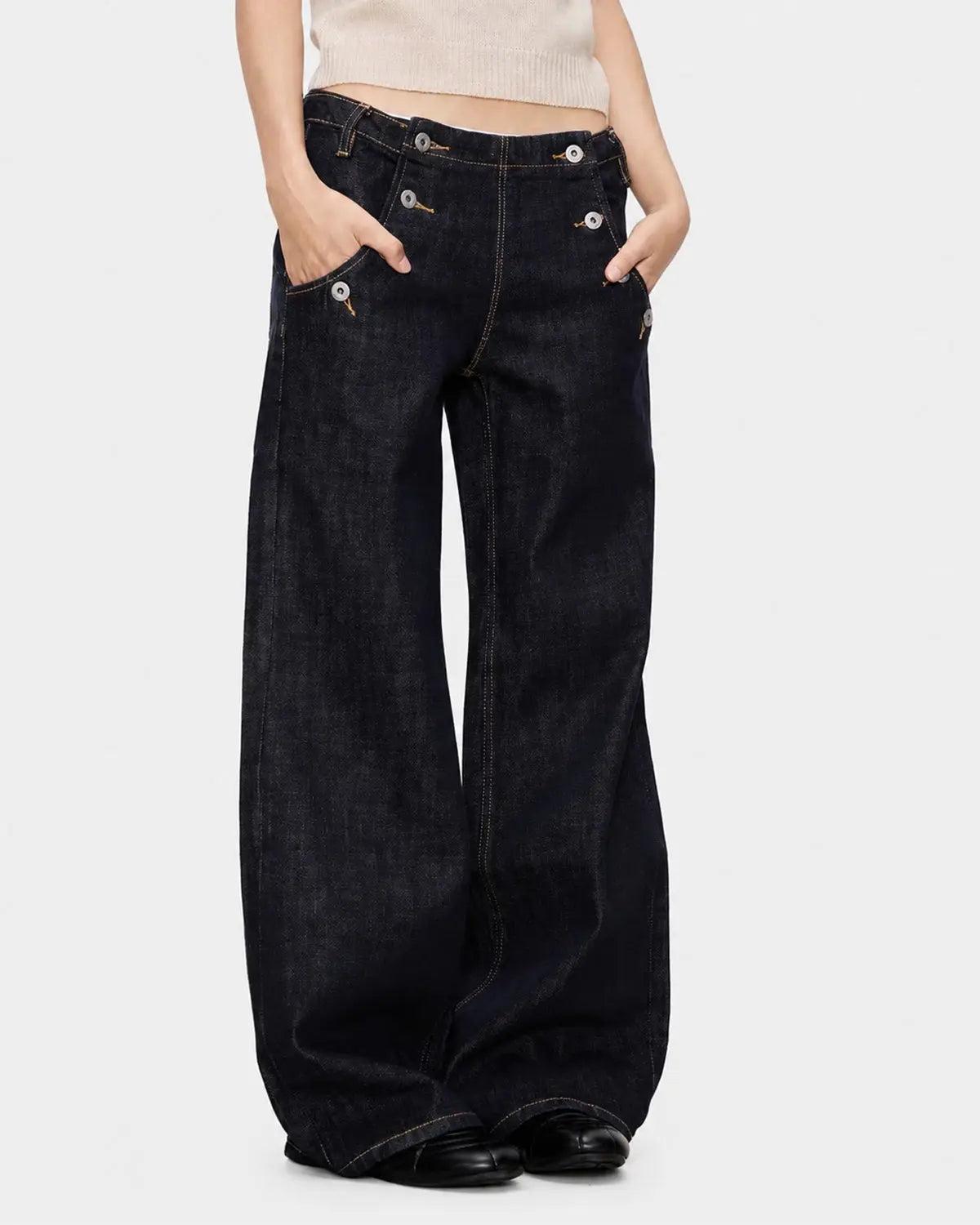Raw wide-leg jeans with button details from Inflation Streetwear, featuring a relaxed fit and classic denim texture.