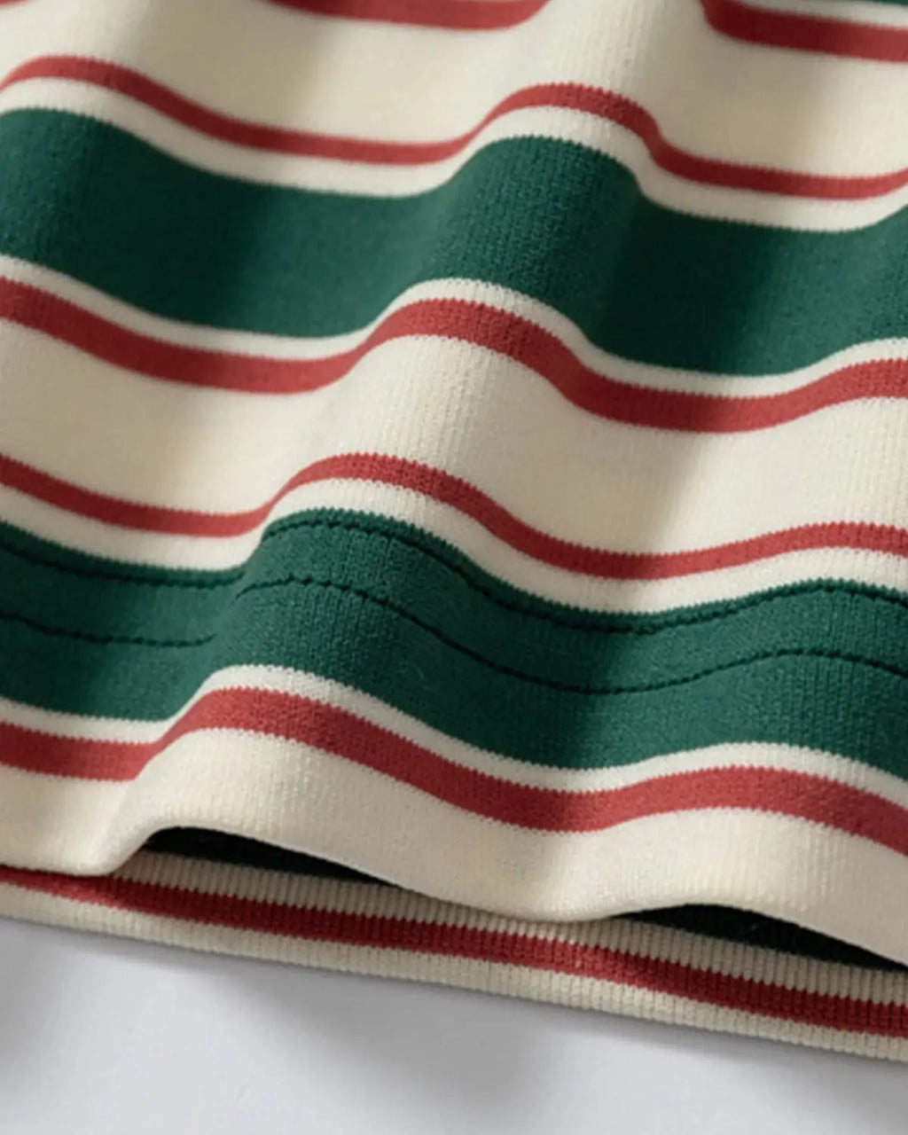 Asymmetric polo collar striped T-shirt by INFLATION, featuring bold design and casual streetwear style in the image.