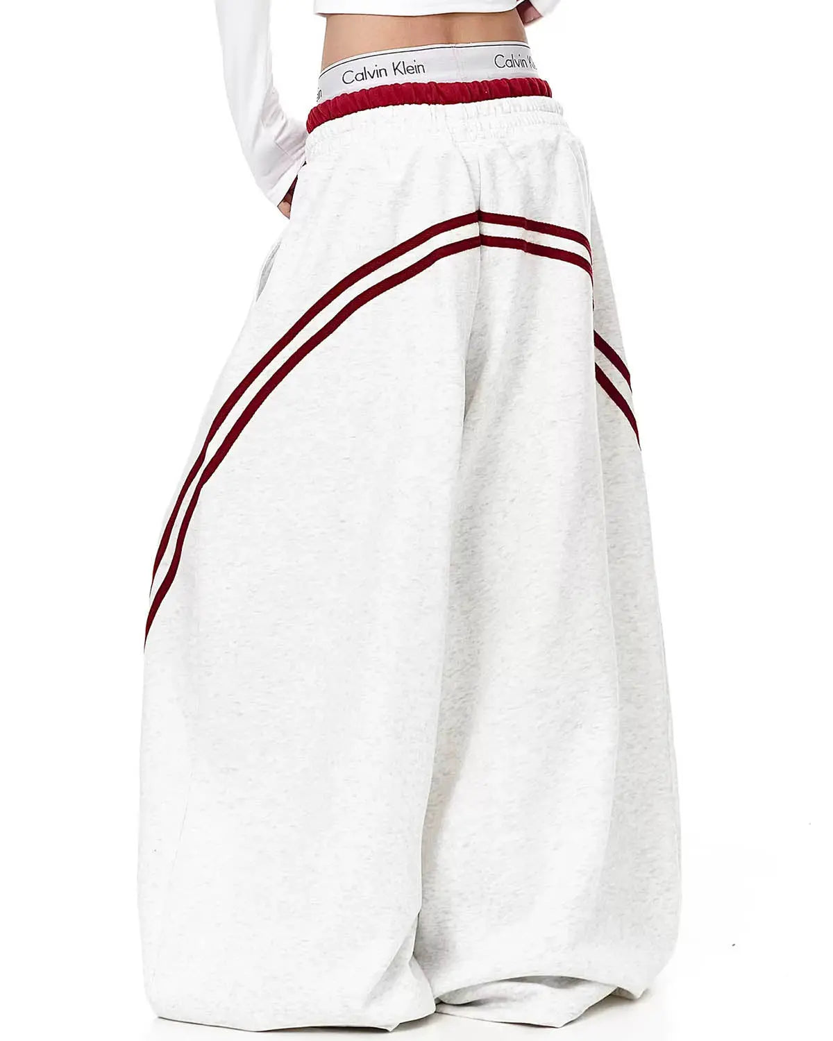 Grey striped baggy sweatpants from Inflation Streetwear with a relaxed fit and elastic waistband, casual and comfortable for everyday wear.