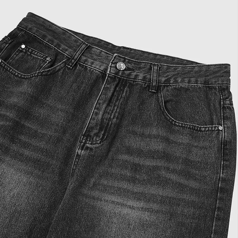 Inflation Chill wide-leg denim pants with relaxed fit and stylish design, shown on a model against a urban background.
