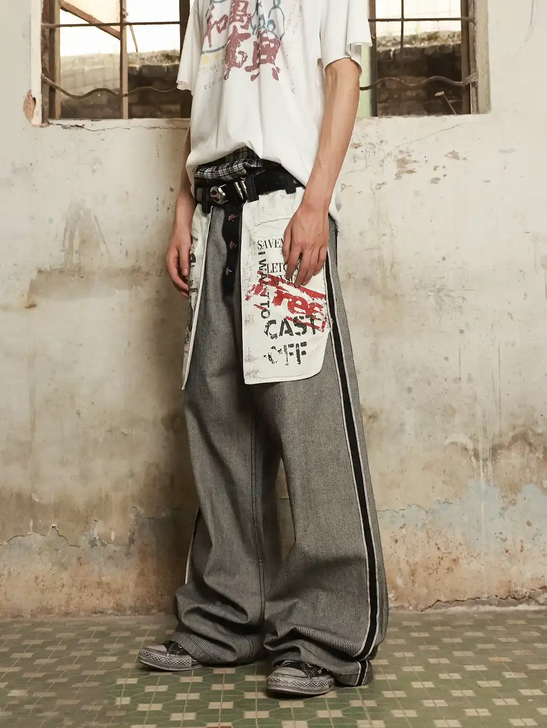 Distressed reverse design baggy jeans by INFLATION Streetwear featuring a relaxed fit and worn-out, artistic denim details.