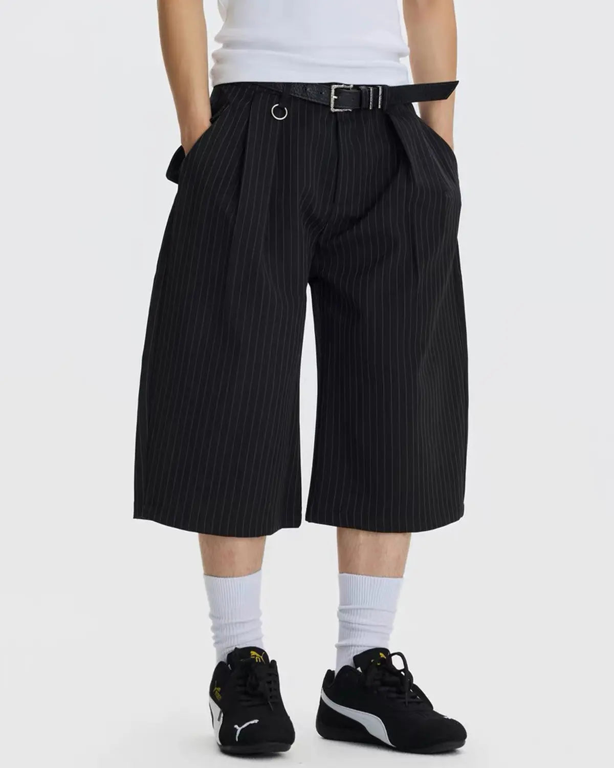 INFLATION Pinstripe Pleated Ring Detail Tailored Shorts, stylish men's pants with pleats and ring accents, tailored fit, front view.