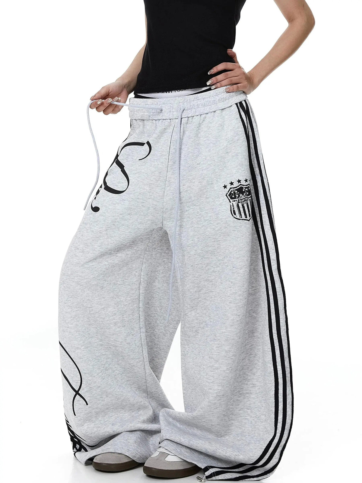 Inflation Script Stripe Baggy Sweatpants with bold stripe design, relaxed fit, soft fabric, and adjustable waistband.