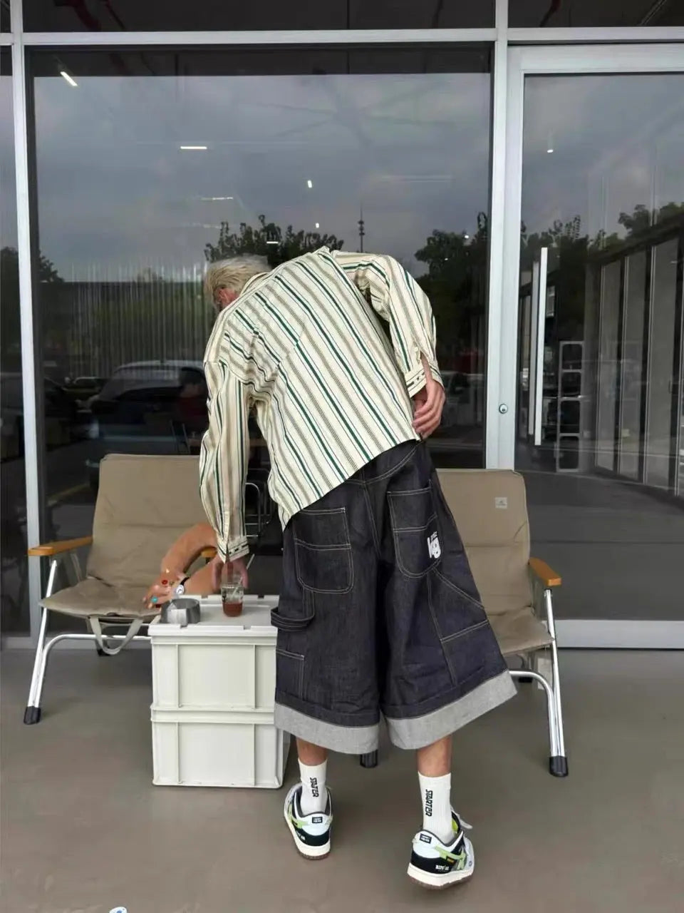 Raw denim carpenter long jorts by INFLATION, casual pants featuring distressed details and a rugged style, shown in the image.