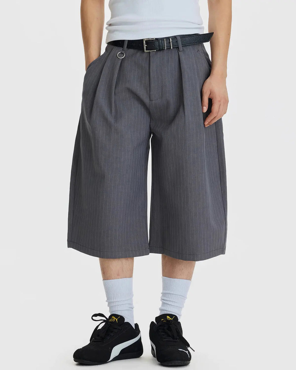 Inflation Streetwear pinstripe pleated tailored shorts with ring detail, featuring a high waist and structured design.