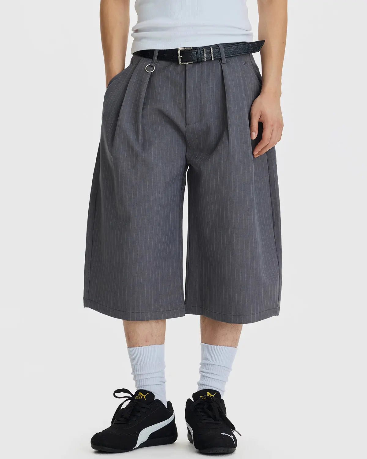 Inflation Streetwear pinstripe pleated tailored shorts with ring detail, featuring a high waist and structured design.