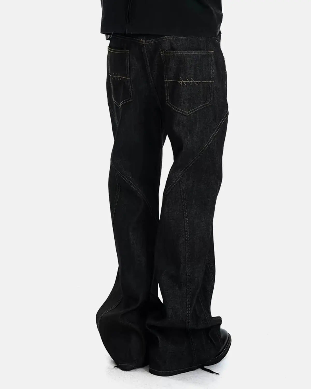 Inflation streetwear asymmetric button bootcut jeans with stylish design, visible button details and classic denim fabric.