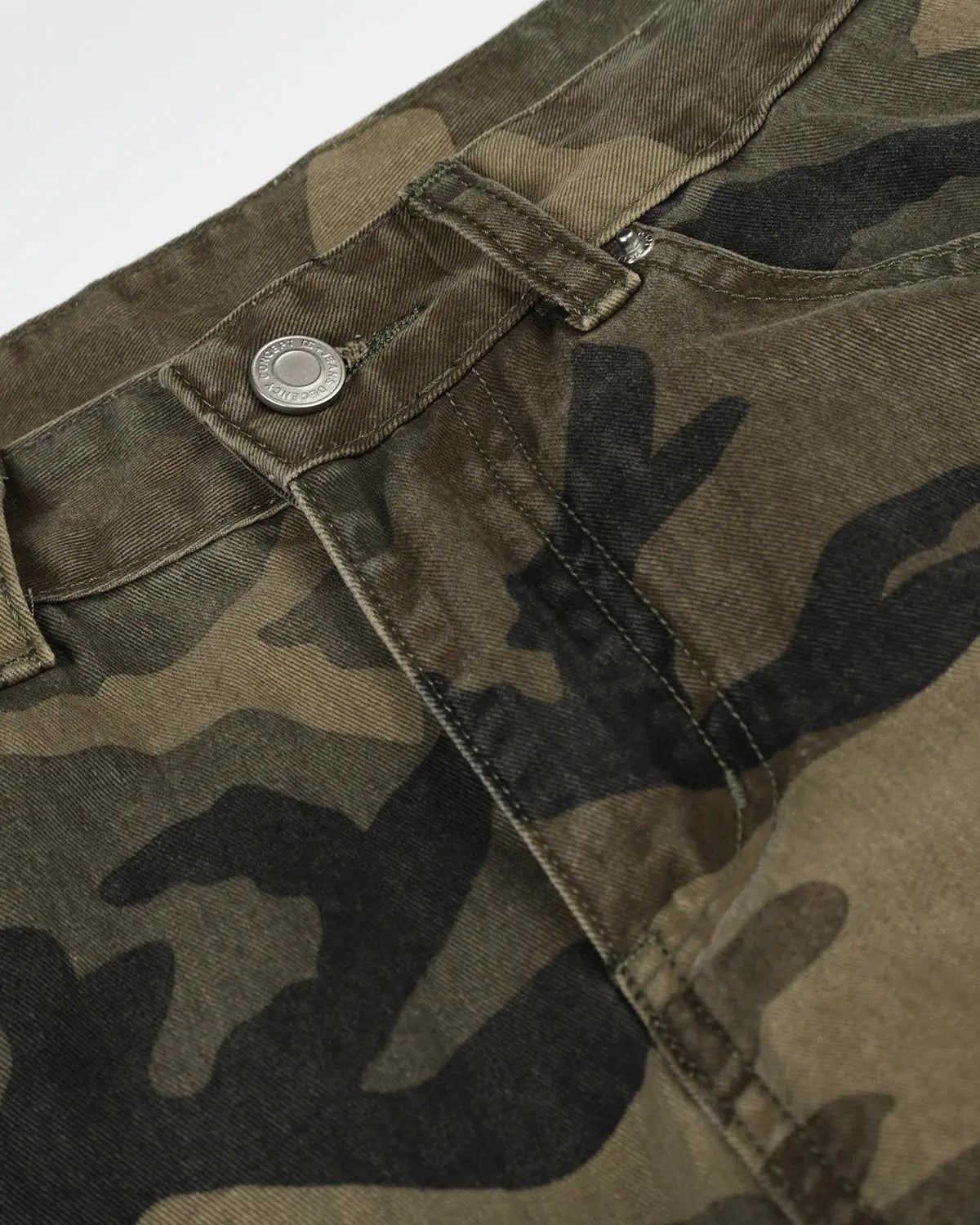 Camo cargo barrel pants by INFLATION featuring a camouflage pattern, relaxed fit, and multiple utility pockets.