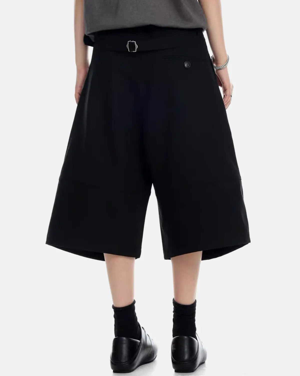 Inflation Streetwear pleated cinch back tailored shorts, stylish pants with a high waist and pleated design, on a neutral background.