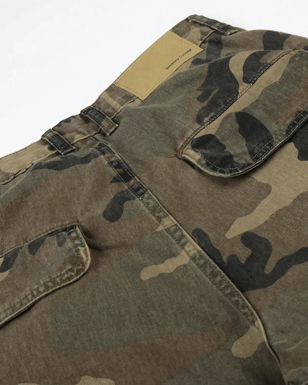 Inflation Camo Cargo Barrel Pants with multiple pockets and relaxed fit, featuring a green and beige camouflage pattern.