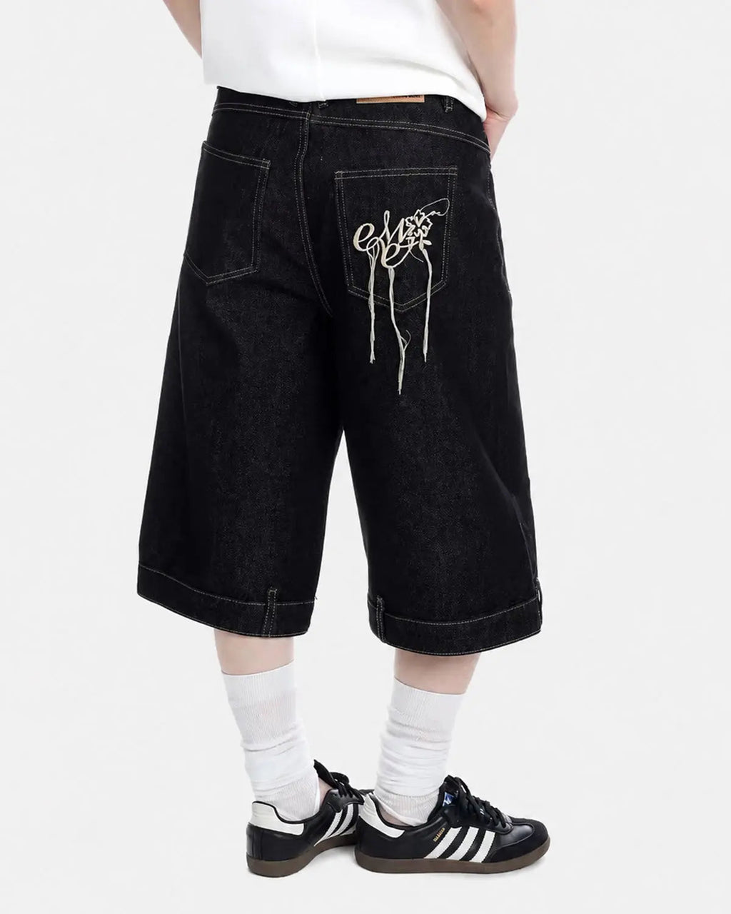 Deconstructed raw denim jorts from Inflation Streetwear, casual pants with distressed detailing and frayed hems.