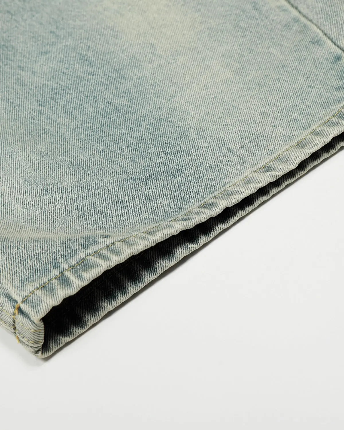 Acid washed baggy jeans with double waist design by INFLATION, featuring a relaxed fit and streetwear style.