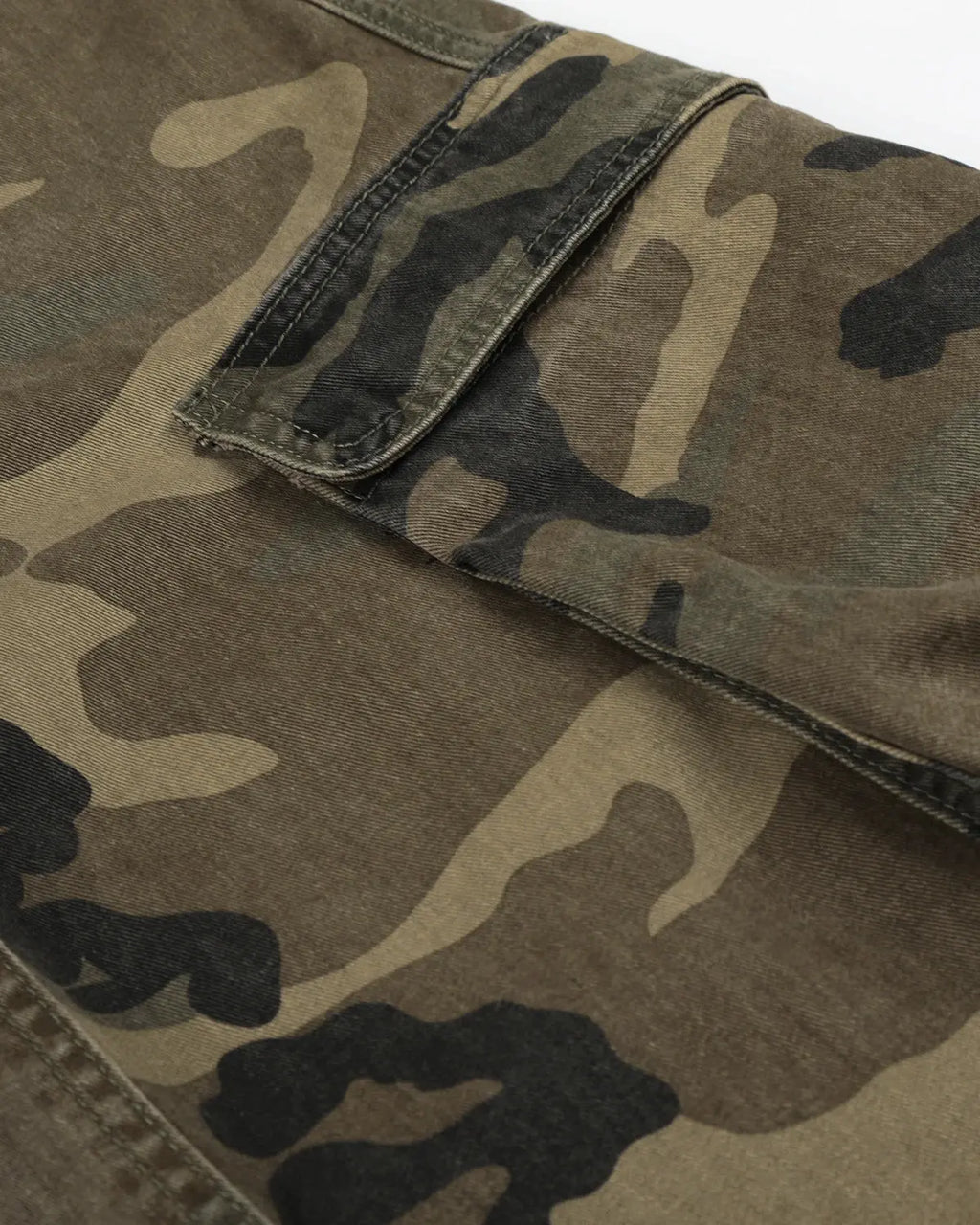 Inflation Camo Cargo Barrel Pants featuring a rugged camo pattern, multiple pockets, and a relaxed streetwear fit.