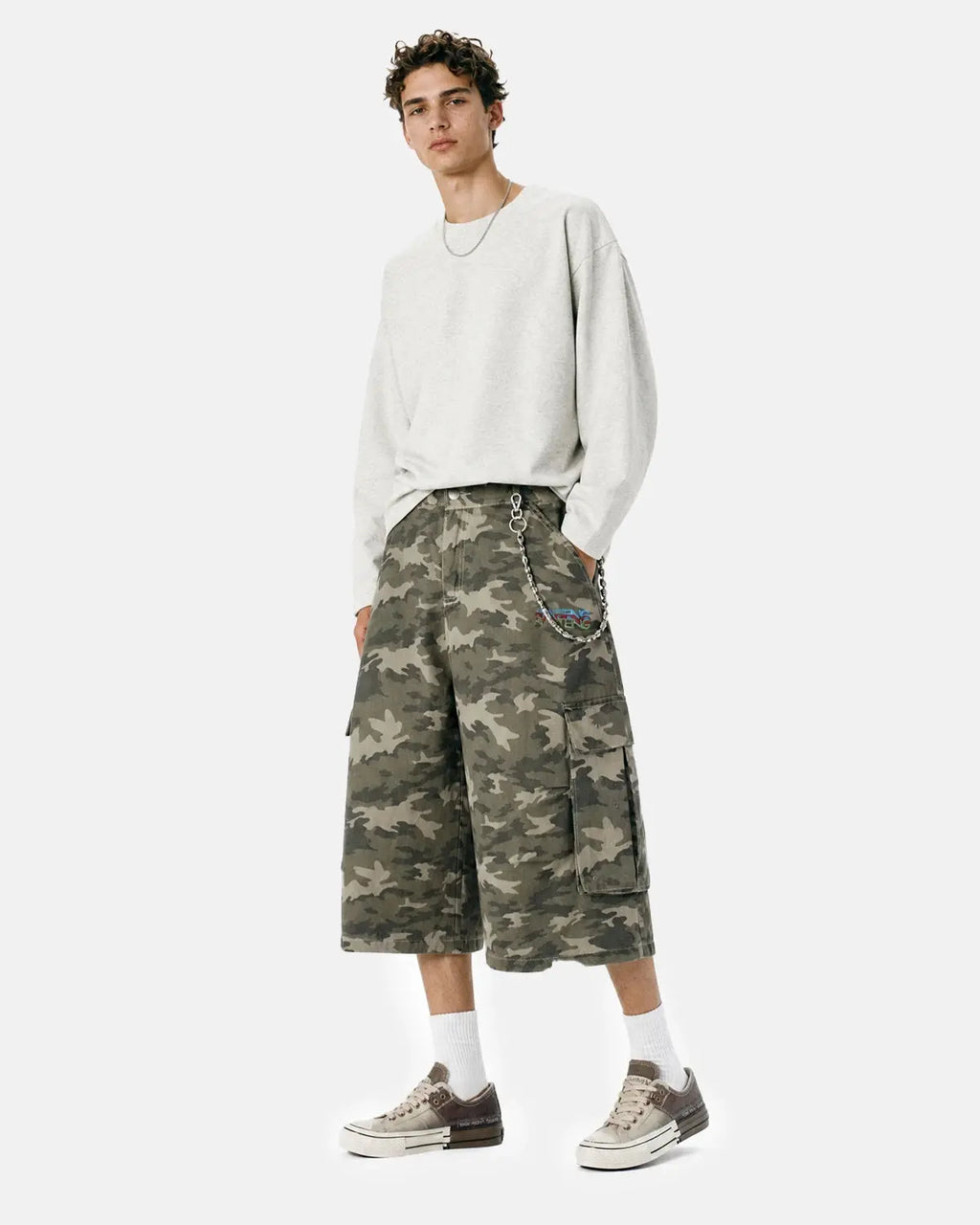 Embroidered camo cargo longline shorts from Inflation Streetwear with detailed embroidery and a relaxed fit.