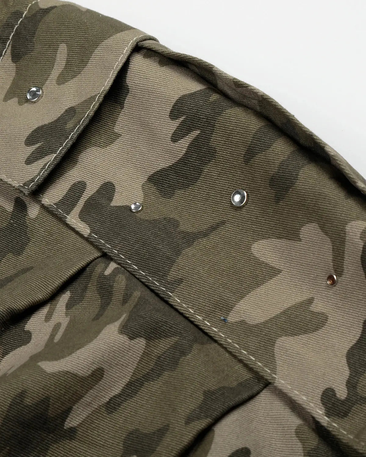 Inflation brand embroidered camo cargo longline shorts with multiple pockets and a relaxed fit, featuring detailed camouflage embroidery.