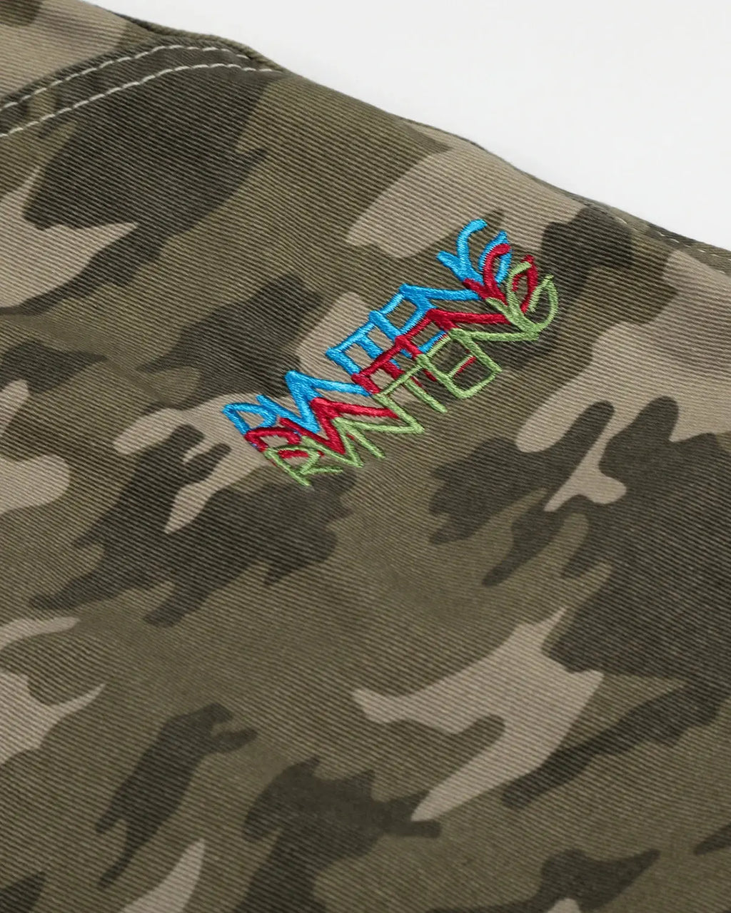 Inflation Streetwear embroidered camo cargo longline shorts with multiple pockets and a relaxed fit, featuring camouflage pattern details.