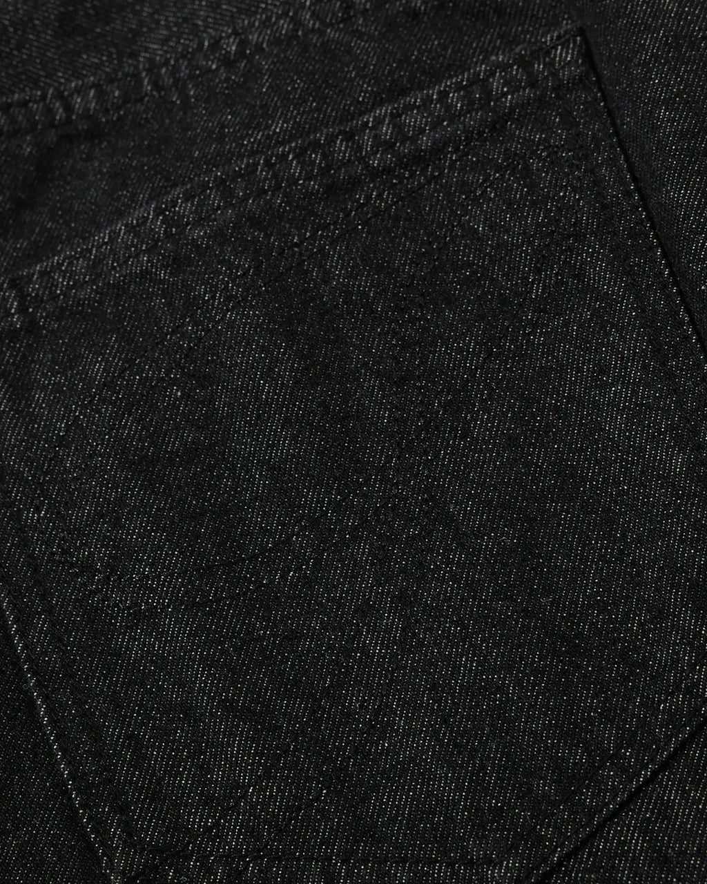Asymmetric raw denim jorts by INFLATION, stylish streetwear pants with button details and distressed raw denim finish.