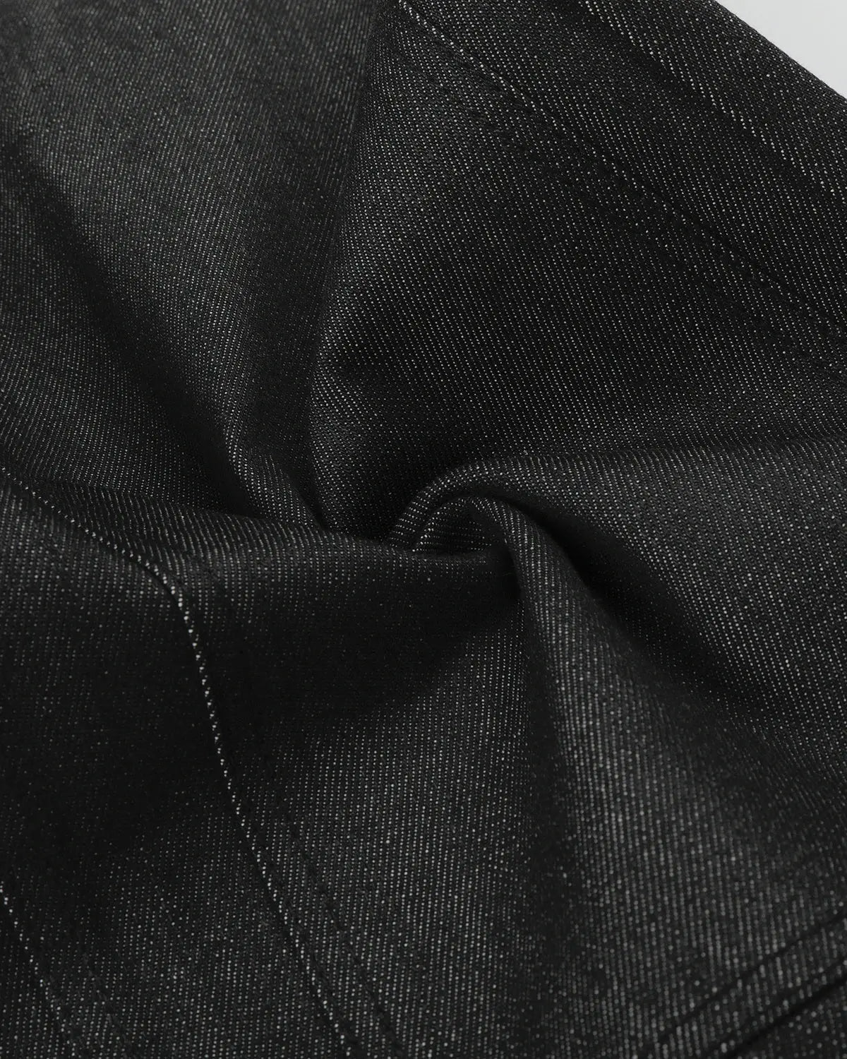 Deconstructed utility baggy jeans by INFLATION featuring a relaxed fit, multiple pockets, and distressed denim details.