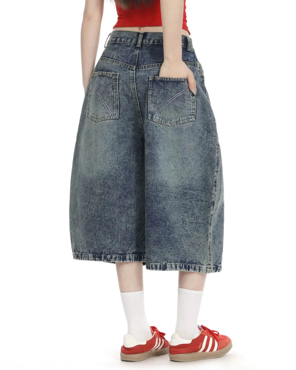 Inflation Streetwear studded washed long baggy jorts pants with distressed denim, large pockets, and metal stud details.