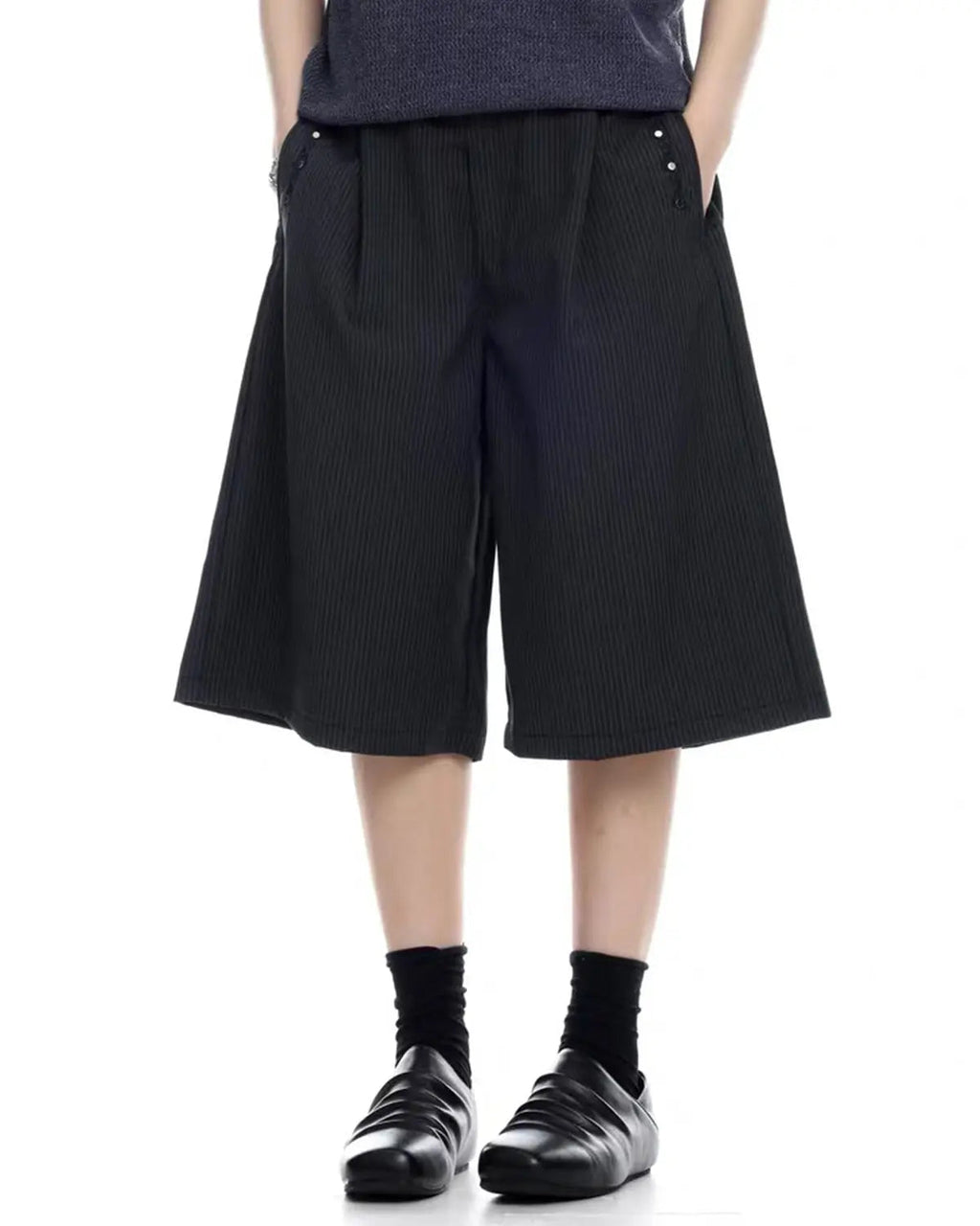 Inflation Streetwear pinstripe tailored shorts with stud details, shown as stylish pants with a sleek, fitted design and pinstripe pattern.