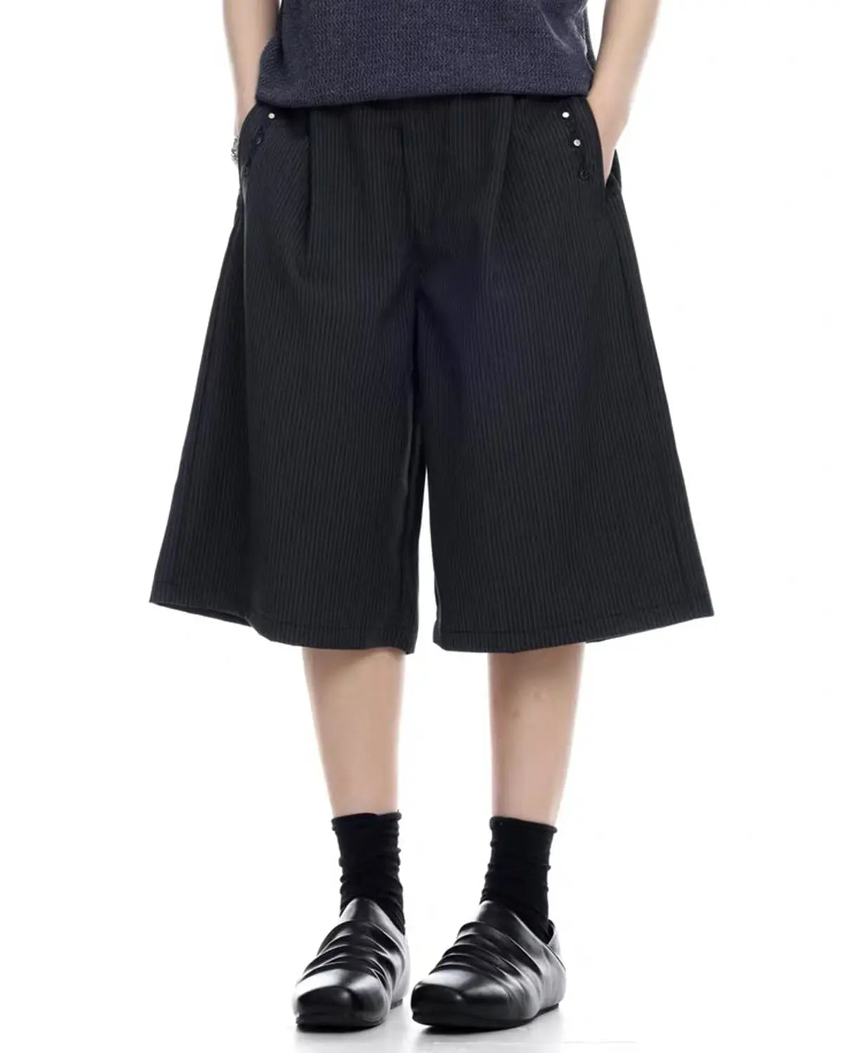 Inflation Streetwear pinstripe tailored shorts with stud details, shown as stylish pants with a sleek, fitted design and pinstripe pattern.