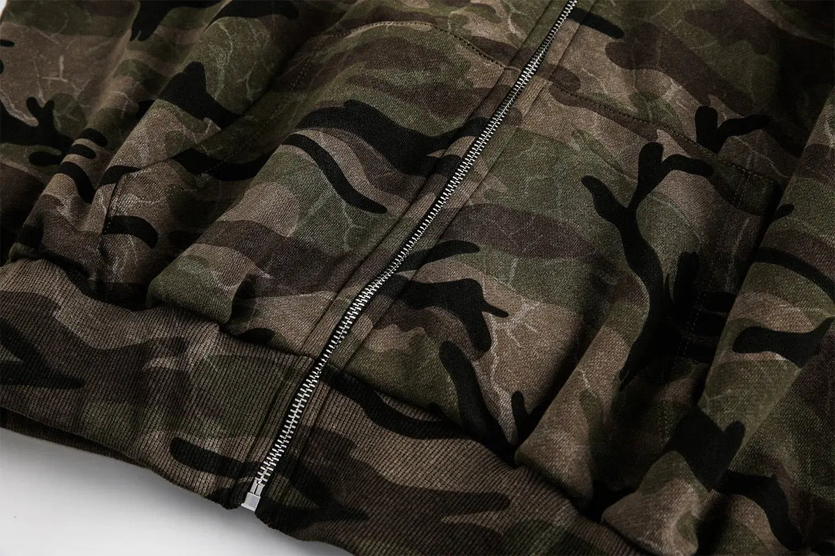 Camouflage zip-up jacket by INFLATION, featuring a trendy streetwear style with a front zipper and camouflage pattern.